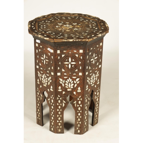 137 - A 19TH CENTURY BONE AND MOTHER OF PEARL INLAID OCCASIONAL TABLE of octagonal shape with arched cut o... 