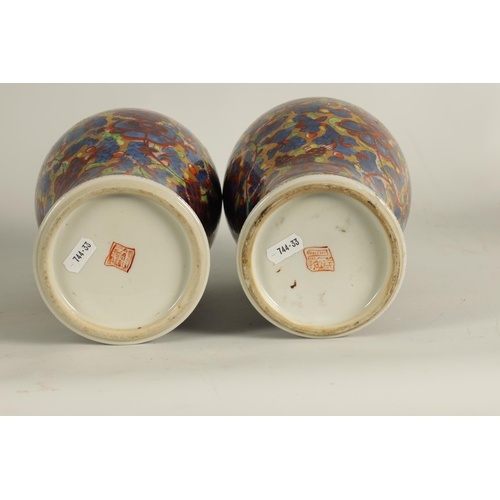 138 - A PAIR OF CHINESE KANGXI PERIOD INVERTED BALUSTER VASES AND COVERS with 19th century colourful all-o... 