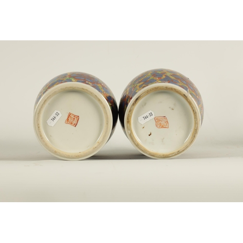 138 - A PAIR OF CHINESE KANGXI PERIOD INVERTED BALUSTER VASES AND COVERS with 19th century colourful all-o... 