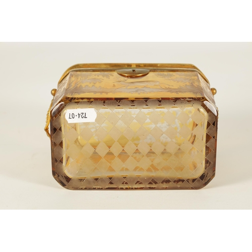 14 - A 19TH CENTURY BOHEMIAN AMBER GLASS OVERLAY CASKET with etched decoration depicting Stags amongst tr... 