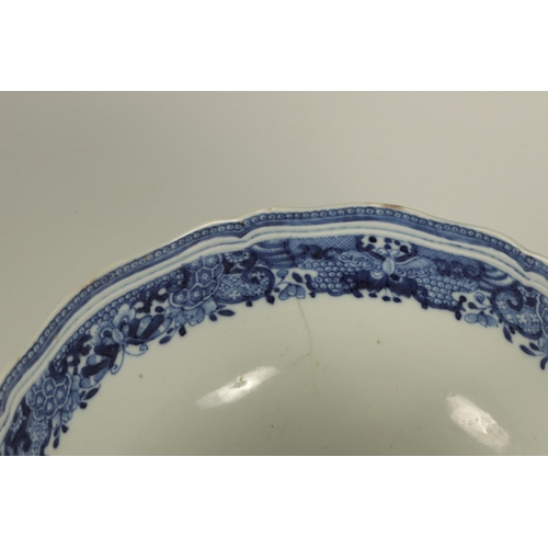 140 - A 19TH CENTURY CHINESE BLUE ANDS WHITER PORCELAIN BOWL with wavey edge floral pattern and coloured m... 