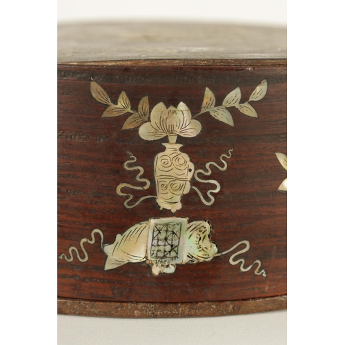 144 - A 19TH CENTURY CHINESE HARDWOOD AND MOTHER OF PEARL INLAID CIRCULAR BOX OF LARGE SIZE the lift-off t... 