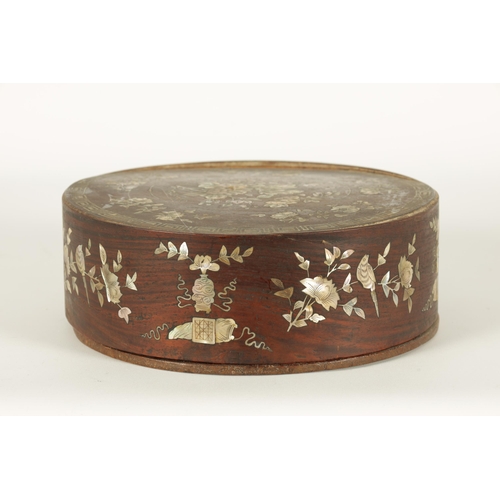 144 - A 19TH CENTURY CHINESE HARDWOOD AND MOTHER OF PEARL INLAID CIRCULAR BOX OF LARGE SIZE the lift-off t... 