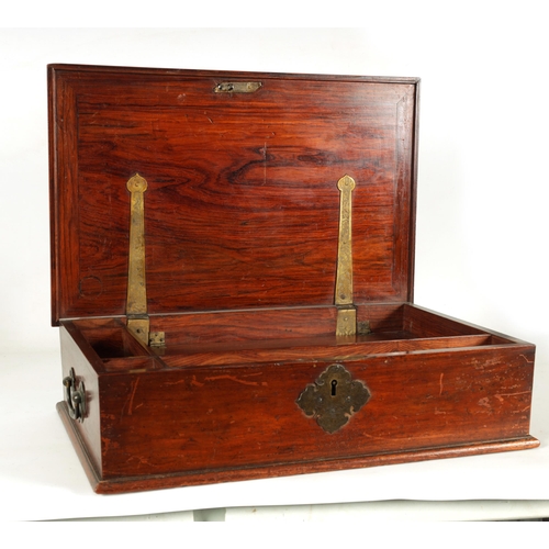 145 - A 17TH/18TH CENTURY CHINESE HARDWOOD LIDDED BOX with brass fittings and side handles; the fitted int... 