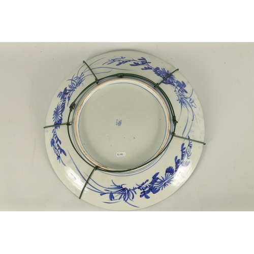 147 - A JAPANESE MEIJI PERIOD BLUE AND WHITE CHARGER with bird and tree decoration in a landscape setting.... 