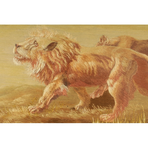 150 - A MEIJI PERIOD JAPANESE SILK EMBROIDERED PANEL depicting a lion and lioness in a landscape setting -... 