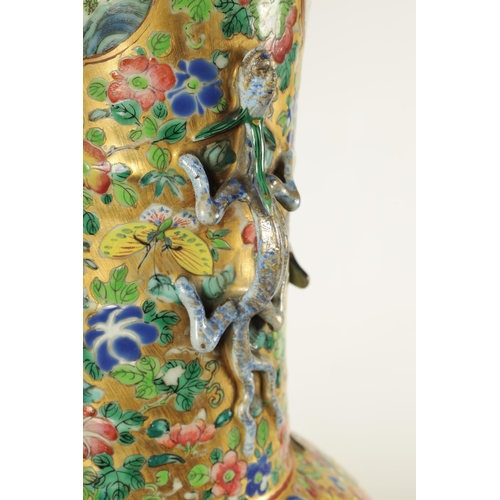 164 - A LARGE 19TH CENTURY CHINESE FAMILLE ROSE PORCELAIN VASE with gilt floral ground enclosing two large... 