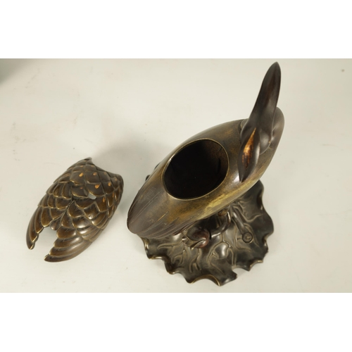 167 - A PAIR OF JAPANESE MEIJI PERIOD BRONZE AND GOLD INLAID CENSERS modelled as perched cranes with lift ... 