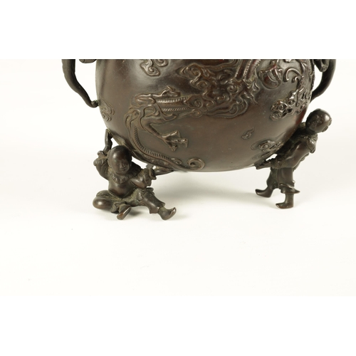 180 - A JAPANESE MEIJI PERIOD PATINATED BRONZE KORO AND COVER the domed lid surmounted by a seated man on ... 