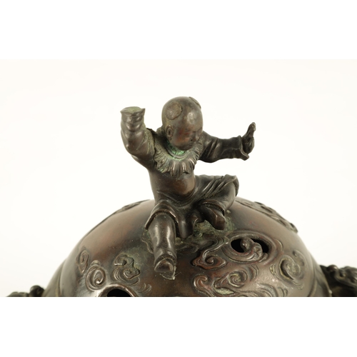 180 - A JAPANESE MEIJI PERIOD PATINATED BRONZE KORO AND COVER the domed lid surmounted by a seated man on ... 