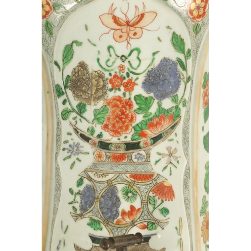 183 - A CHINESE FAMILLE VERTE KANGXI PERIOD SHAPED WATER CISTERN decorted with sprays of flowers (34cm hig... 