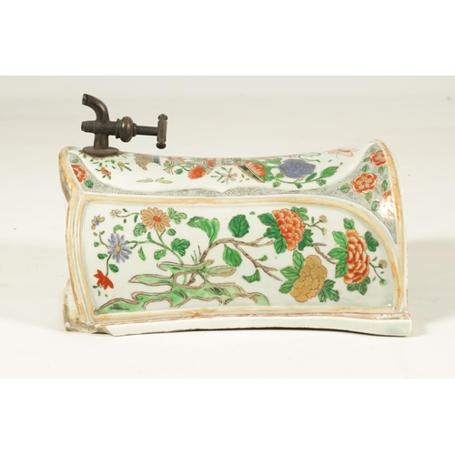 183 - A CHINESE FAMILLE VERTE KANGXI PERIOD SHAPED WATER CISTERN decorted with sprays of flowers (34cm hig... 