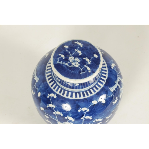 187 - A 19TH CENTURY CHINESE BLUE AND WHITE PRUNUS BLOSSOM GINGER JAR AND COVER of bulbous form having fou... 