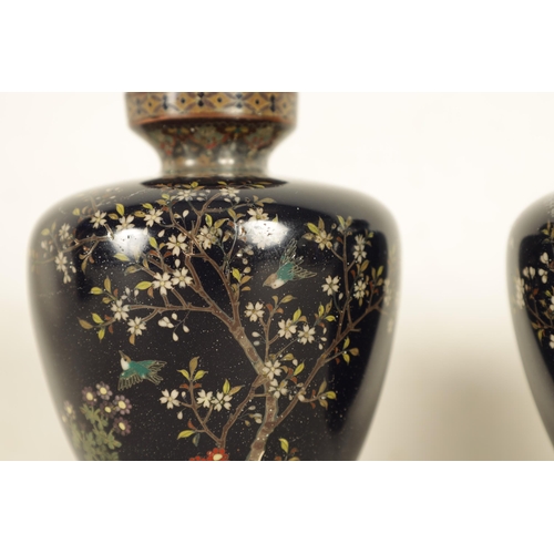 189 - A SMALL PAIR OF JAPANESE MEIJI PERIOD CLOISONNE VASES dark blue ground and decorated with silver wir... 