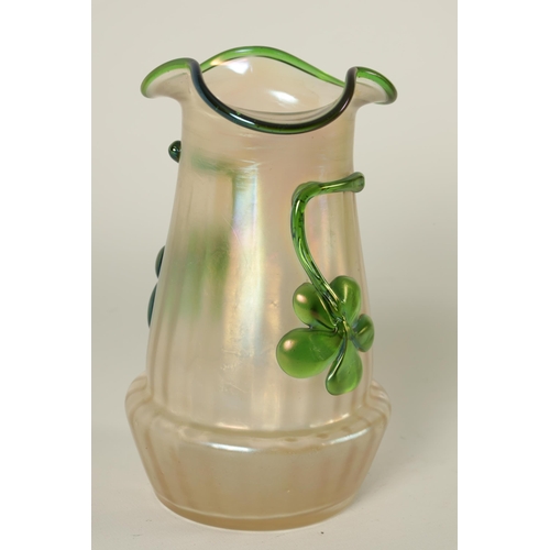 19 - A LATE 19TH CENTURY WHITEFRIARS STYLE GREEN GLASS EWER with slender neck and bulbous body, shaped ha... 