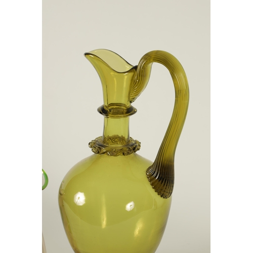 19 - A LATE 19TH CENTURY WHITEFRIARS STYLE GREEN GLASS EWER with slender neck and bulbous body, shaped ha... 