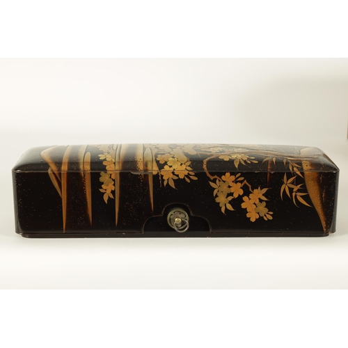 191 - A JAPANESE MEIJI PERIOD BLACK LACQUERWORK SCROLL BOX with raised gilt decoration of prunus trees in ... 