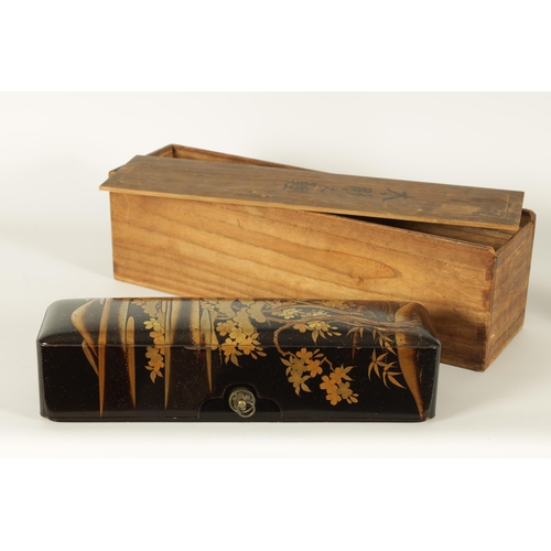 191 - A JAPANESE MEIJI PERIOD BLACK LACQUERWORK SCROLL BOX with raised gilt decoration of prunus trees in ... 