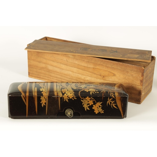 191 - A JAPANESE MEIJI PERIOD BLACK LACQUERWORK SCROLL BOX with raised gilt decoration of prunus trees in ... 