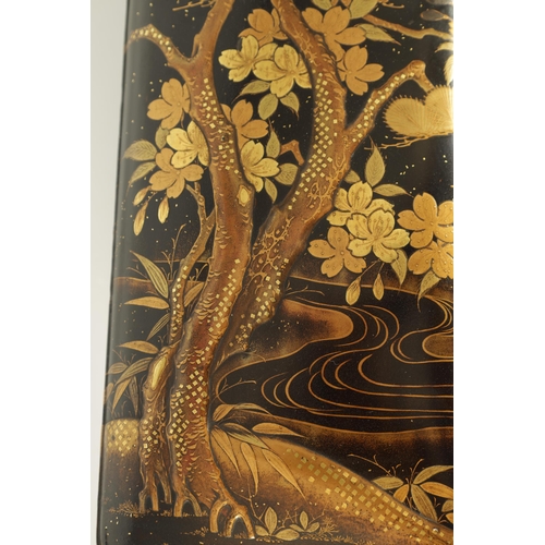 191 - A JAPANESE MEIJI PERIOD BLACK LACQUERWORK SCROLL BOX with raised gilt decoration of prunus trees in ... 