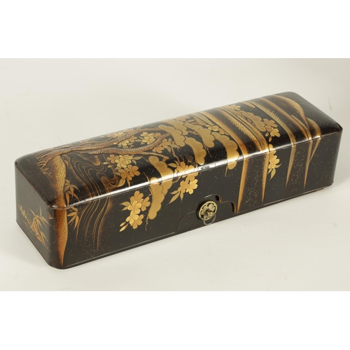 191 - A JAPANESE MEIJI PERIOD BLACK LACQUERWORK SCROLL BOX with raised gilt decoration of prunus trees in ... 