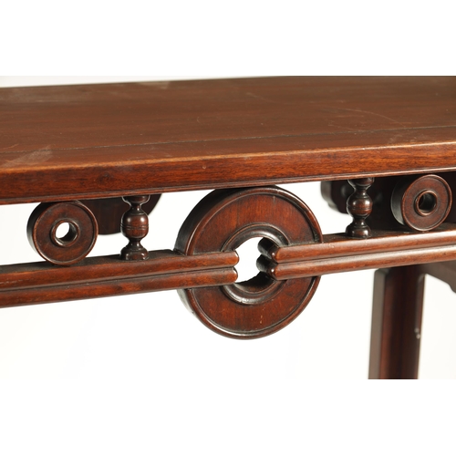 192 - A 19TH CENTURY CHINESE HARDWOOD ALTAR TABLE the cleated top with carved scrolled ends and cut-out fr... 