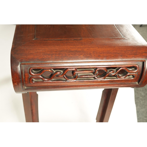 192 - A 19TH CENTURY CHINESE HARDWOOD ALTAR TABLE the cleated top with carved scrolled ends and cut-out fr... 