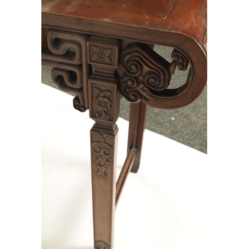 192 - A 19TH CENTURY CHINESE HARDWOOD ALTAR TABLE the cleated top with carved scrolled ends and cut-out fr... 