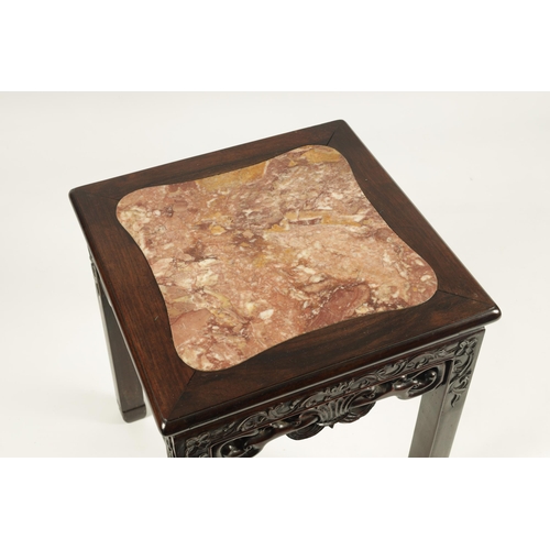 193 - A 19TH CENTURY CHINESE HARDWOOD JARDINIERE TABLE with shaped inset variegated pink marble top, above... 