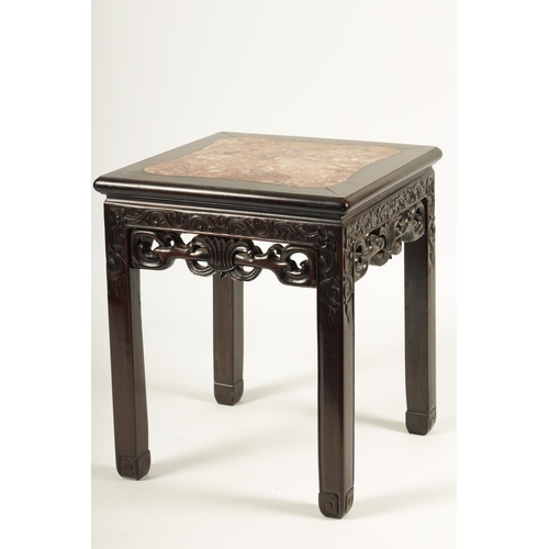 193 - A 19TH CENTURY CHINESE HARDWOOD JARDINIERE TABLE with shaped inset variegated pink marble top, above... 