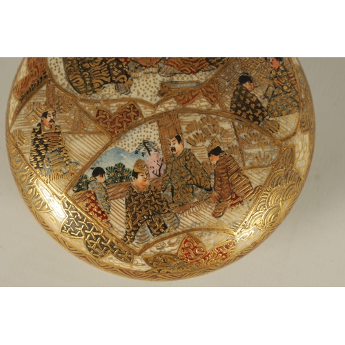 196 - A JAPANESE MEIJI PERIOD SATSUMA LIDDED BOWL depicting seated figures amongst ritual scenes throughou... 