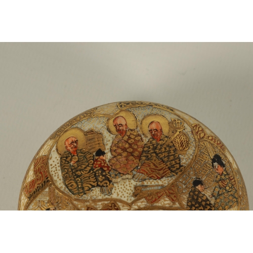 196 - A JAPANESE MEIJI PERIOD SATSUMA LIDDED BOWL depicting seated figures amongst ritual scenes throughou... 