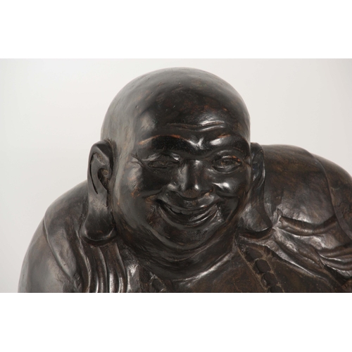 198 - A 19TH CENTURY CHINESE CARVED HARDWOOD SCULPTURE OF A SEATED BUDDHA (48cm wide.)