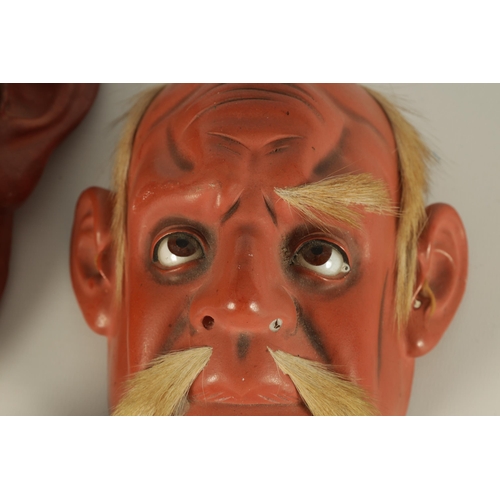 200 - A GROUP OF THREE JAPANESE MEIJI PERIOD LACQUER WORK FACE MASKS realistically modelled with painted e... 