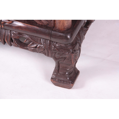 203 - A 19TH CENTURY CHINESE CHICKEN WING WOOD STANDING WHATNOT with a faux bamboo frame and leaf carved c... 