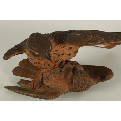 204 - A FINE JAPANESE MEIJI PERIOD CARVED WOOD BIRD FIGURE GROUP depiciting a pair of Kestrels fighting, i... 