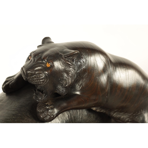 206 - AN UNUSUAL MEIJI PERIOD JAPANESE PATINATED BRONZE ANIMAL GROUP depiciting a hippo and a tiger - moun... 