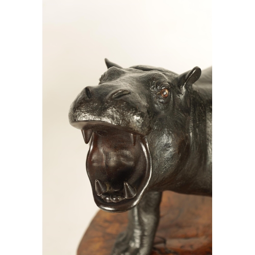 206 - AN UNUSUAL MEIJI PERIOD JAPANESE PATINATED BRONZE ANIMAL GROUP depiciting a hippo and a tiger - moun... 