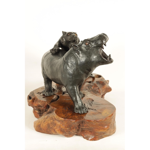 206 - AN UNUSUAL MEIJI PERIOD JAPANESE PATINATED BRONZE ANIMAL GROUP depiciting a hippo and a tiger - moun... 