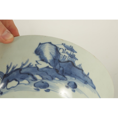 207 - AN 18TH CENTURY CHINESE BLUE AND WHITE BOWL FROM THE NANKING CARGO decorated lake and rocky landscap... 