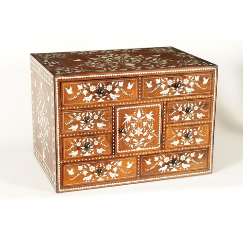 208 - A GOOD 19TH CENTURY ANGLO INDIAN HARDWOOD AND IVORY INLAID TABLE CABINET fitted small drawers to the... 