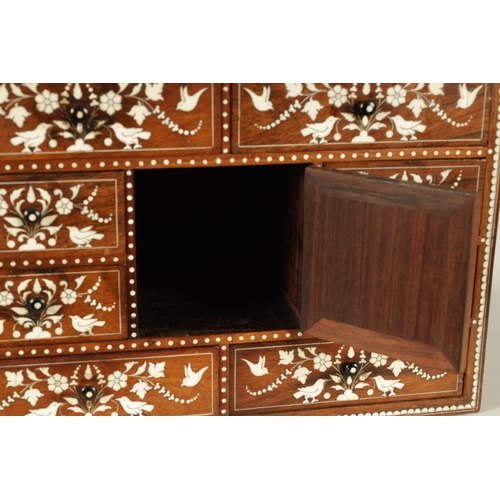 208 - A GOOD 19TH CENTURY ANGLO INDIAN HARDWOOD AND IVORY INLAID TABLE CABINET fitted small drawers to the... 