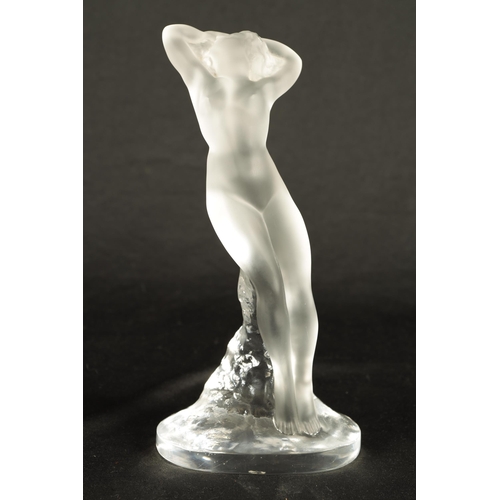 21 - A FRENCH RENE LALIQUE 'DANSEUSE BRAS LEVES' FROSTED GLASS FIGURINE of a nude female dancer with rais... 