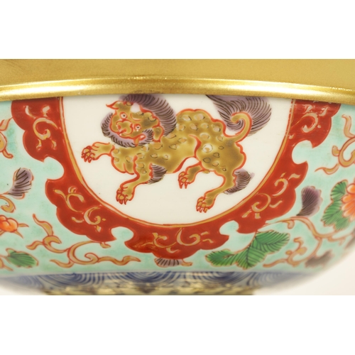 210 - AN ORMOLU MOUNTED CHINESE BOWL pale blue ground with floral decoration enclosing foo dog panels, the... 