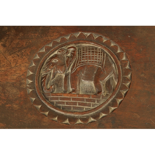 216 - A LATE 19TH CENTURY CARVED INDIAN 'ELEPHANT' TABLE having a carved oval top supported on four legs f... 