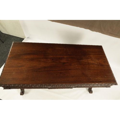 217 - A REGENCY ANGLO INDIAN CARVED HARDWOOD LIBRARY TABLE of good colour and patina, the polished top wit... 