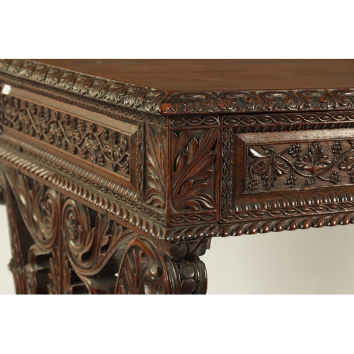 217 - A REGENCY ANGLO INDIAN CARVED HARDWOOD LIBRARY TABLE of good colour and patina, the polished top wit... 