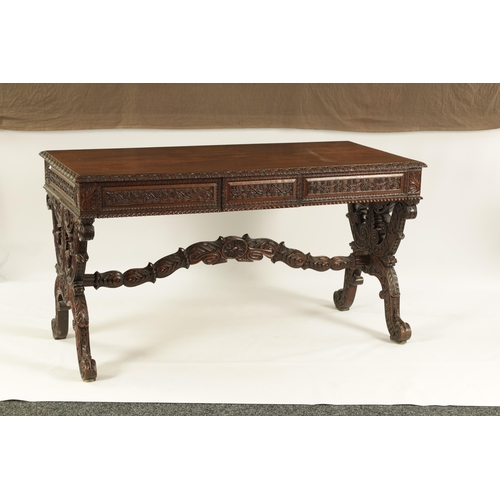 217 - A REGENCY ANGLO INDIAN CARVED HARDWOOD LIBRARY TABLE of good colour and patina, the polished top wit... 