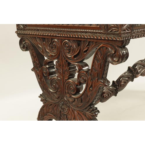 217 - A REGENCY ANGLO INDIAN CARVED HARDWOOD LIBRARY TABLE of good colour and patina, the polished top wit... 