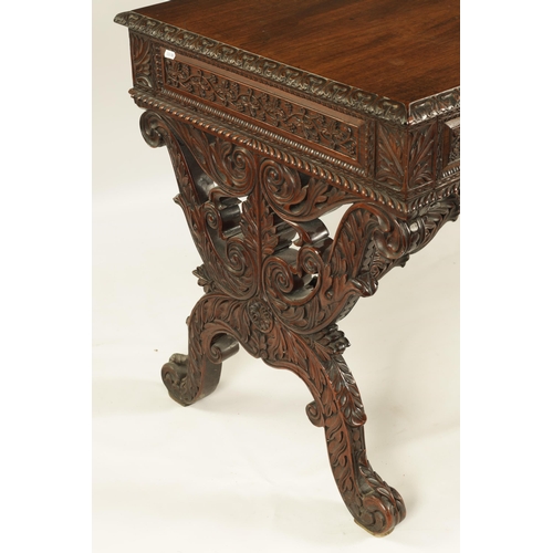 217 - A REGENCY ANGLO INDIAN CARVED HARDWOOD LIBRARY TABLE of good colour and patina, the polished top wit... 